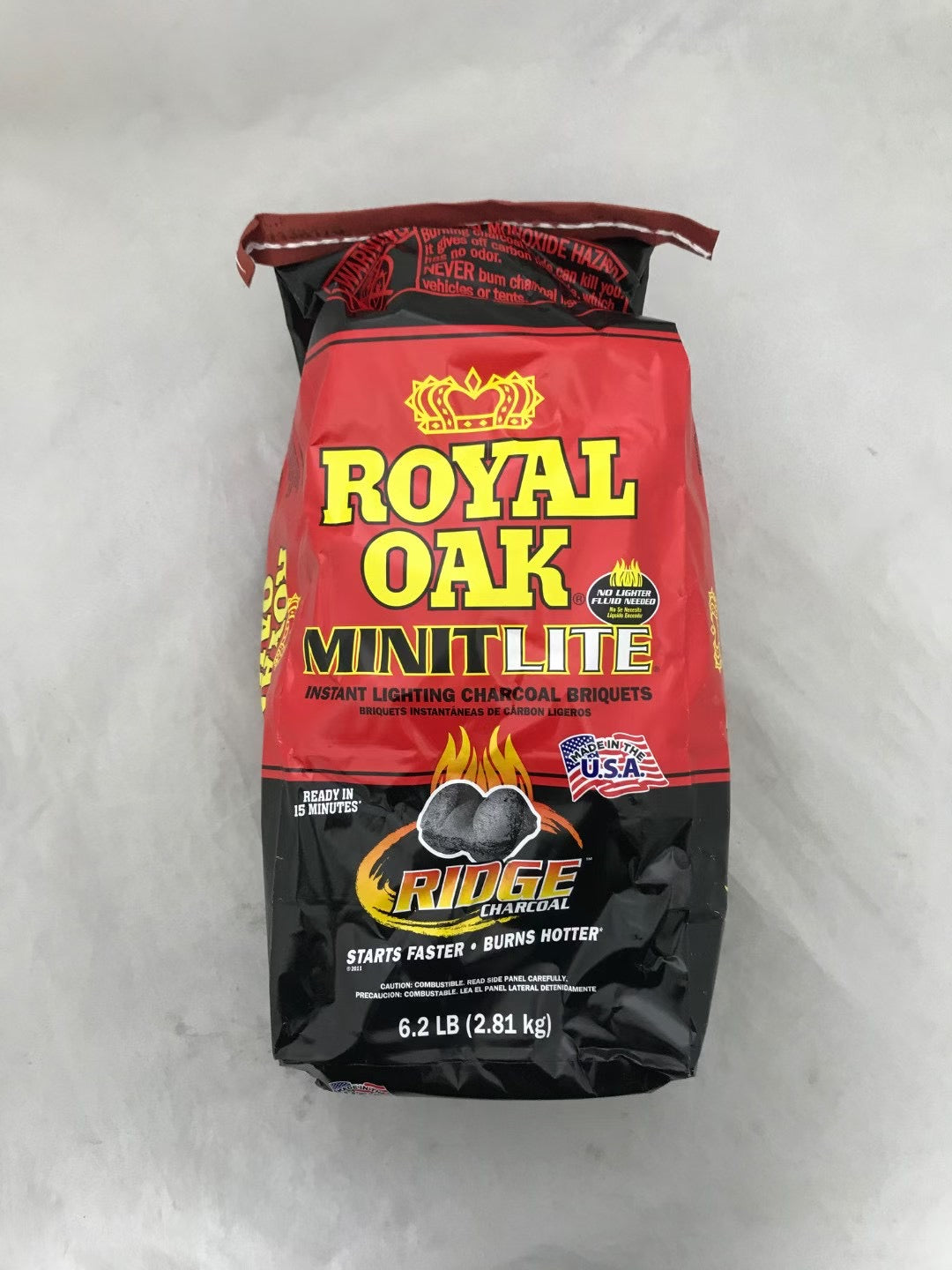 Bag of Royal Oak Minit Lite charcoal briquettes on a white background