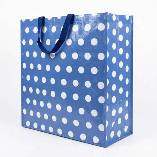 Blue tote bag with white polka dots on a white background