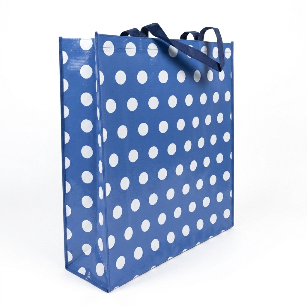 Blue shopping bag with white polka dots on a white background