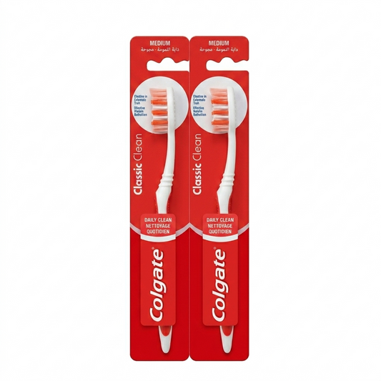 Two Colgate toothbrushes in red packaging on a white background