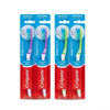 Four Colgate Extra Clean toothbrushes in medium hardness, packaged in their original blue and red retail blister packs against a white background.