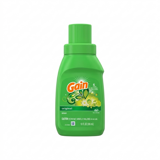 Green bottle of Gain laundry detergent on a white background