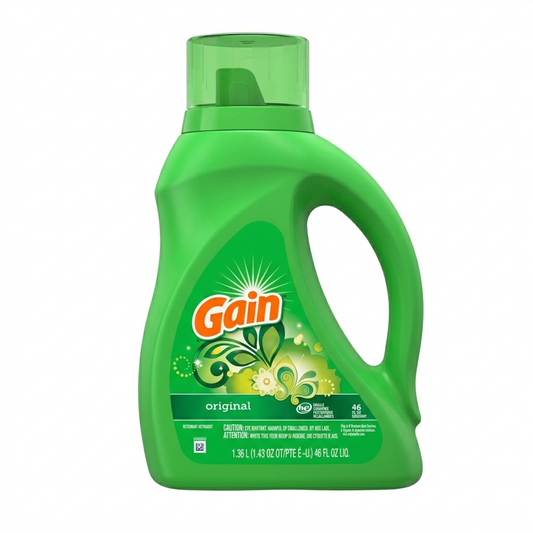 Green bottle of Gain laundry detergent on a white background