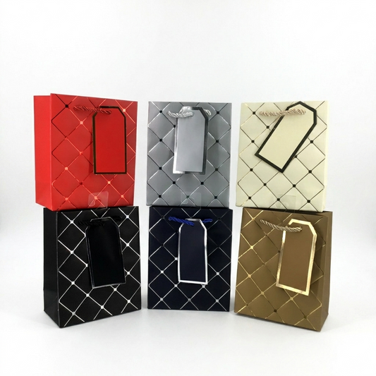 Five quilted paper bags in red, gray, beige, black, and gold on a white background.