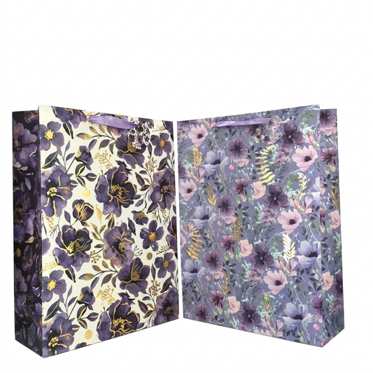 Two floral-patterned gift bags on a white background