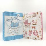 Two baby shower gift bags, one blue with elephant design and 'Baby Shower' text, the other pink with baby carriage and 'Baby Girl' text.