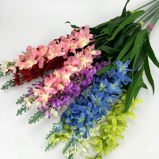 Bouquet of artificial flowers in pink, red, purple, blue, and green on a white background