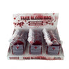 A retail display box containing 24 small fake blood bags labeled 'FAKE BLOOD BAG' and 'ARTIFICIAL BLOOD SPECIAL EFFECTS' with 'EMERGENCY BLOOD' on the front labels.