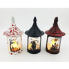 Three Halloween witch-house lanterns with pointed roofs, shown side by side on a white background. The left lantern is white with red splatter and a pumpkin-and-tree design, the middle lantern is black with a skeleton-and-horror scene, and the right lantern is dark red with a haunted-house design.