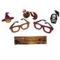 Halloween novelty glasses set with witch hat, pumpkin, skull, bat, crescent moon, and raven accessories, shown with the Partyrite packaging on a white background.