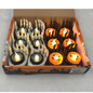 A box of Halloween-themed LED candles, featuring white skeleton hands holding black plates with spiderweb designs and glowing orange candles shaped like pumpkins and spider legs, set against a light gray background.