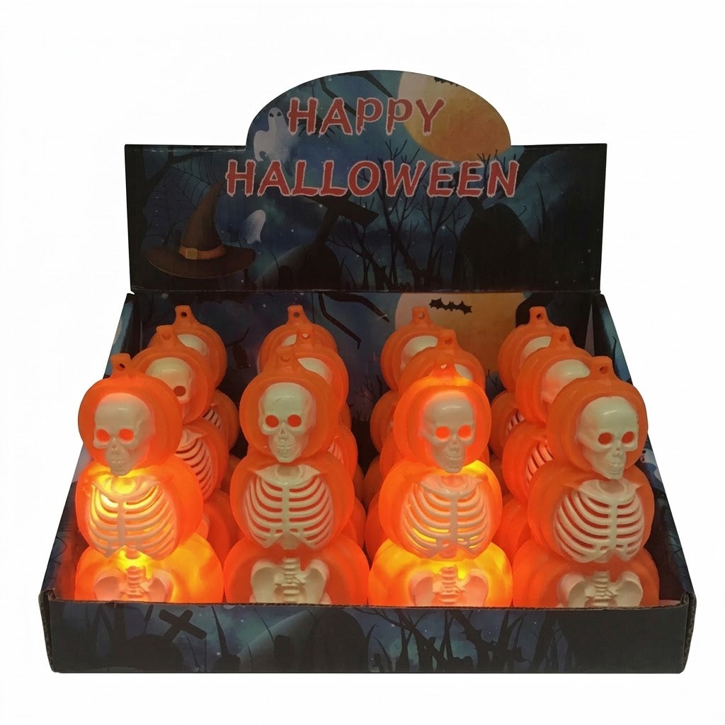 A retail display box filled with small Halloween skeleton ornaments that glow orange. The display header reads “HAPPY HALLOWEEN” over a dark spooky background, and the skeletons inside are illuminated from within.