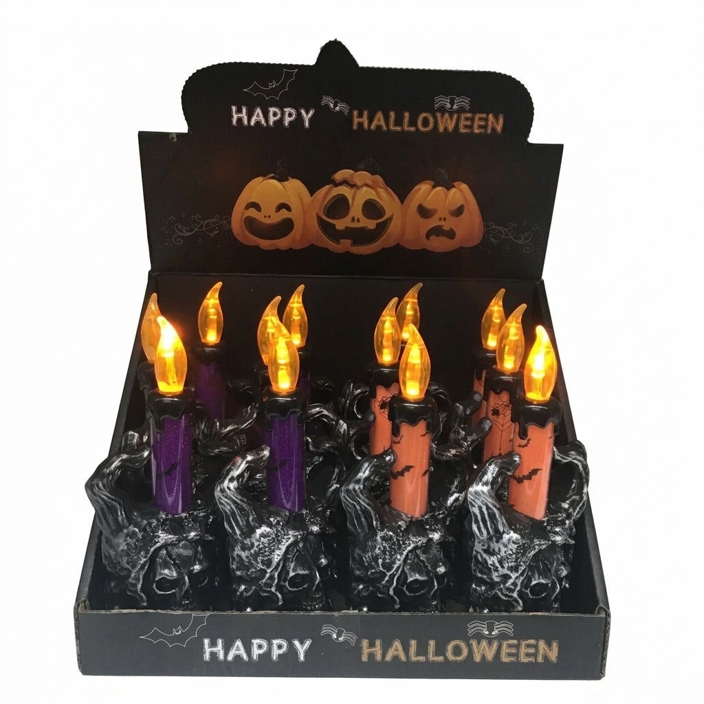 A Halloween candle display box containing multiple fake flame candles in black and orange holders, with a black display header that says HAPPY HALLOWEEN and shows jack-o'-lantern faces.
