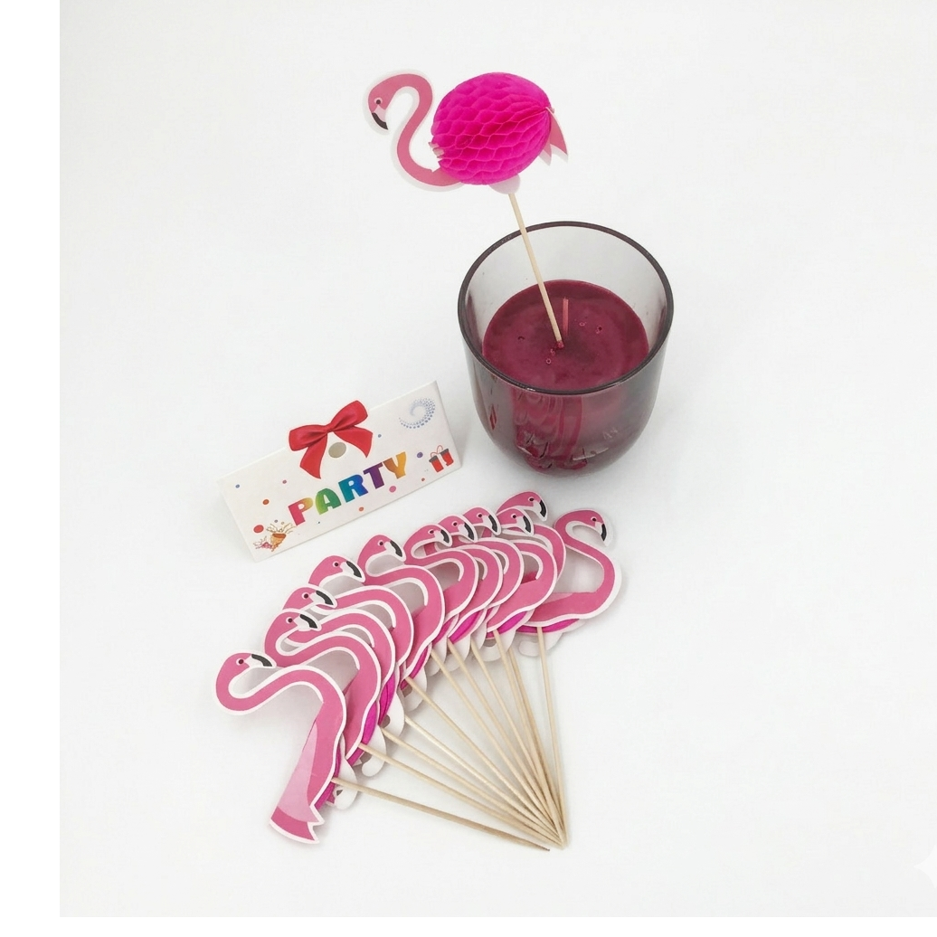 Pink flamingo drink stirrers with a glass of red drink and 'Party' sign on a white background