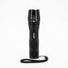 Black flashlight with a strap on a white background
