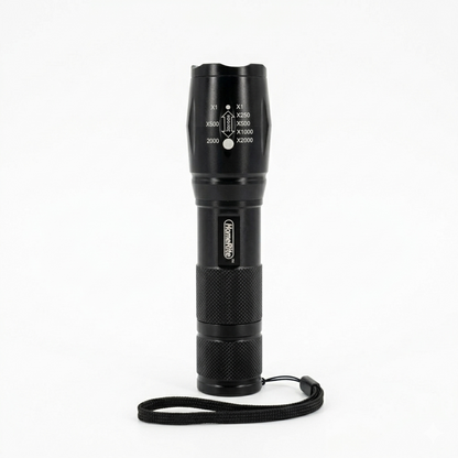 Black flashlight with a strap on a white background