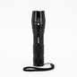 Black flashlight with a strap on a white background