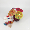 Colorful paper drink umbrellas with decorative designs and a 'PARTY' sign on a white background.