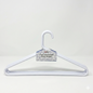 White hanger with a label on a light gray background