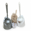Set of three cleaning brushes in different colors with holders on a white background
