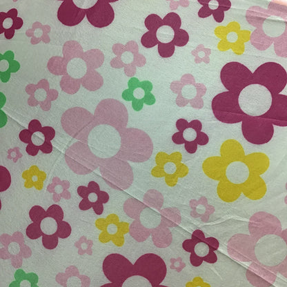 Floral pattern with pink, yellow, and green flowers on a light background