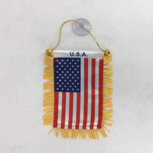 Small American flag with yellow fringe and 'U.S.A.' text on a white background