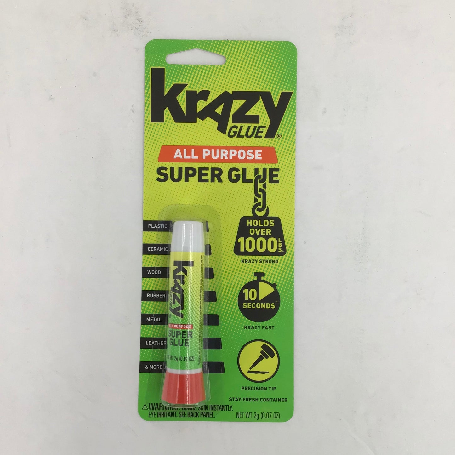 Krazy Glue all-purpose super glue packaging on a light gray background