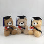 Three teddy bears wearing graduation caps and gowns on a white background