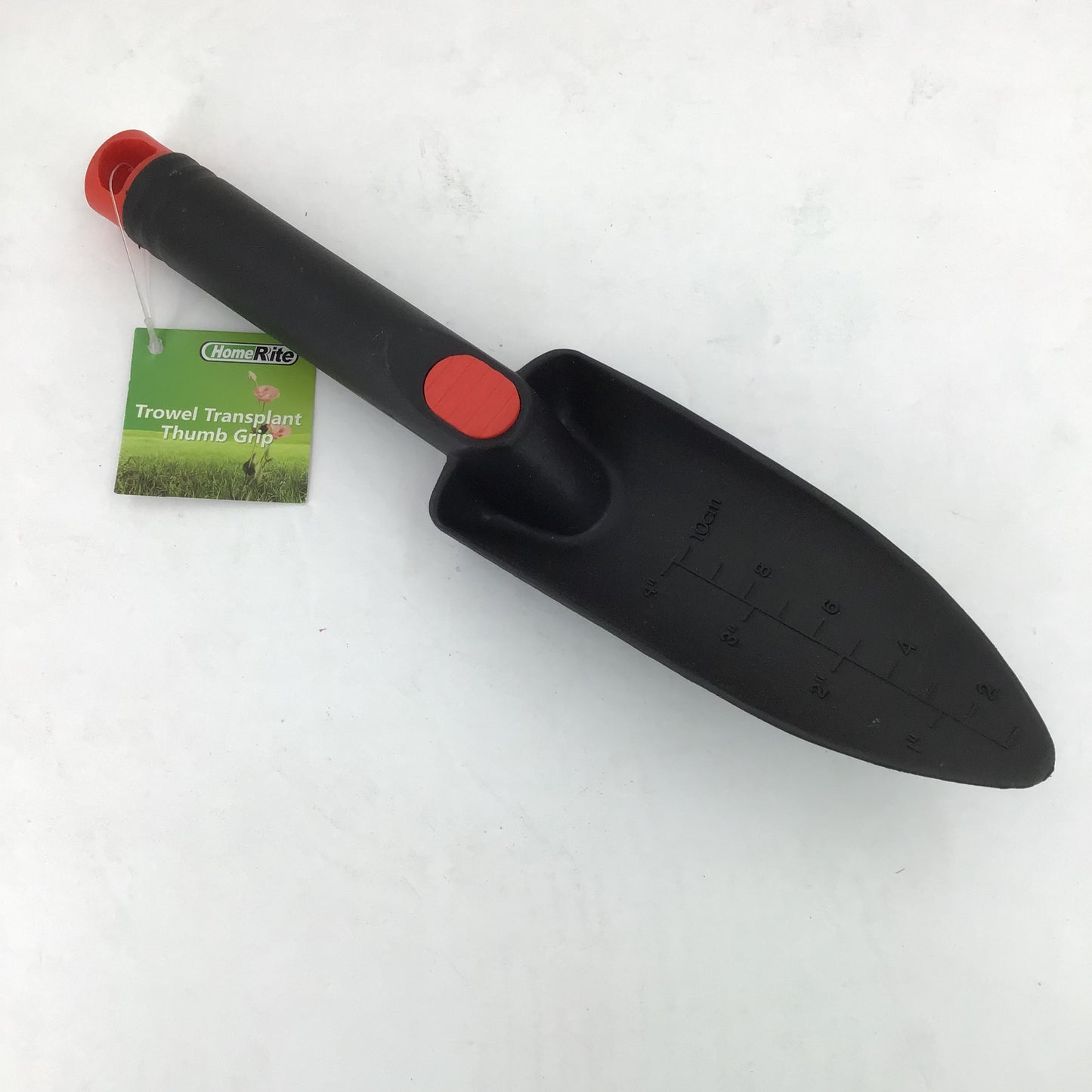 Black garden trowel with red handles on a white background