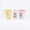 Three plastic pitchers in yellow, white, and pink on a white background