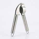 Stainless steel garlic press on a white background