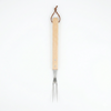 Barbecue fork with wooden handle on a white background