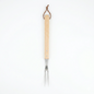 Barbecue fork with wooden handle on a white background