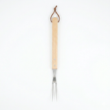 Barbecue fork with wooden handle on a white background