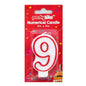 A red and white plastic number 9 birthday candle in its original red 'partyrite' retail packaging, shown against a plain white background.