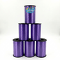 Purple curling ribbon spools stacked on a white background