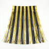 black and gold fringe skirt on a white background