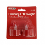 Packaged flickering LED tealight with batteries on a white background