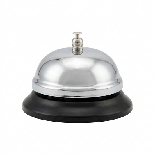 Metallic service bell with black base on a white background