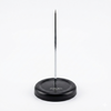 Black magnetic pin holder with a metal pin on a white background
