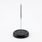 Black magnetic pin holder with a metal pin on a white background